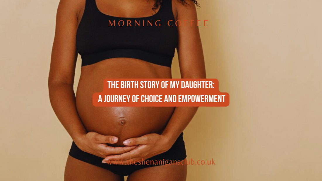 Pregnant black woman holding her baby bump