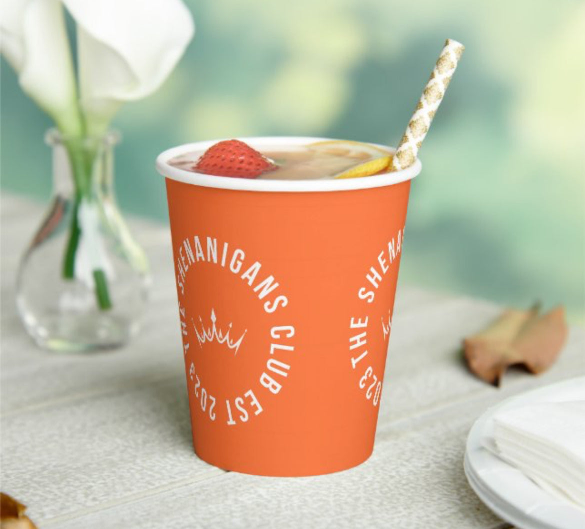 The Shenanigans Club Orange and white paper cup